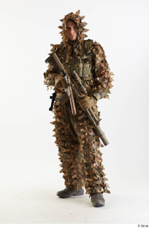 Frankie Perry Standing with Gun in Ghillie holding gun standing…